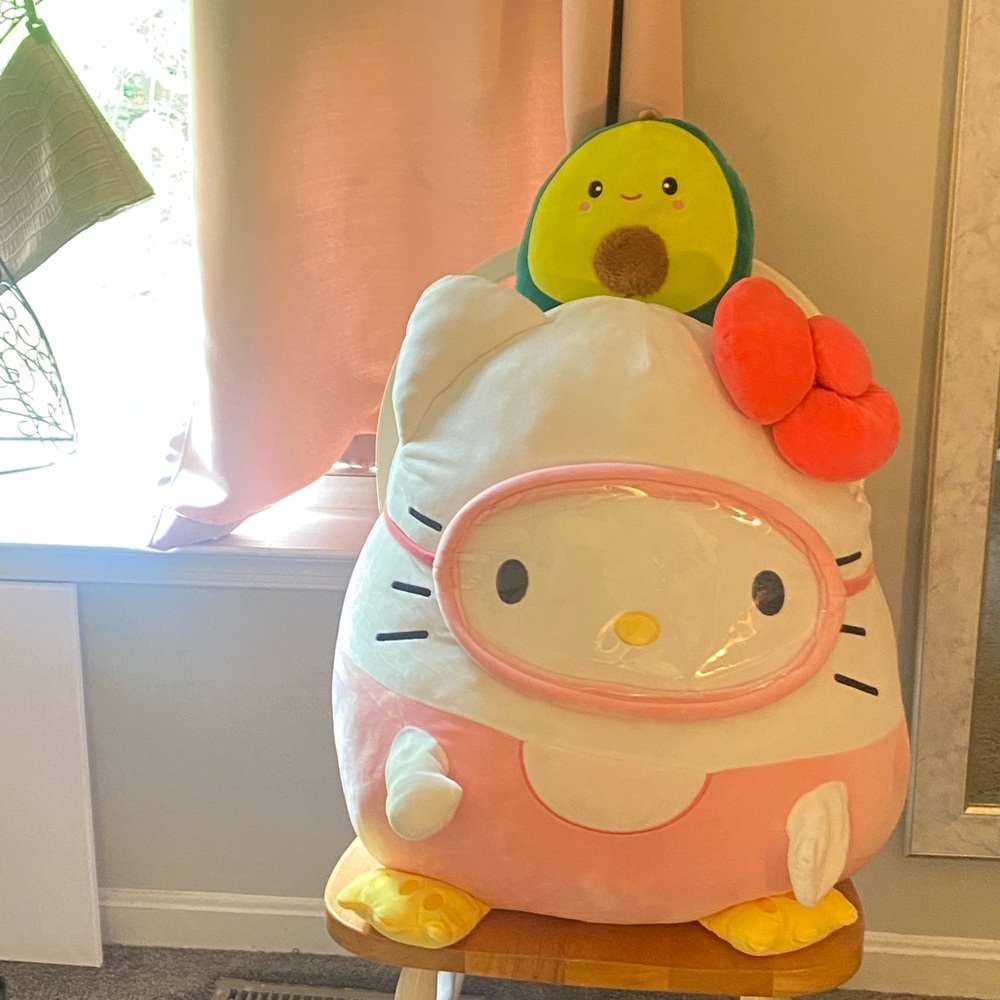 Two Squishes, 1 big hello kitty squishy, 1 mini avocado squishy.